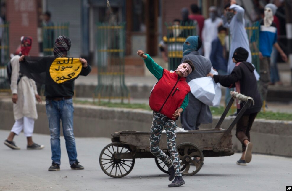 Kashmiri Muslim protesters throw stones at Indian security personnel during a protest in Srinagar, Indian controlled Kashmir.