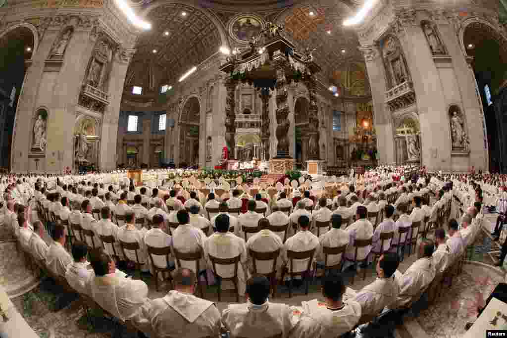 Pope Francis leads the Chrism mass in Saint Peter's Basilica at the Vatican.
