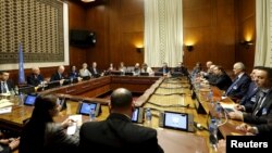 An overview of the room where Staffan de Mistura, the U.N. mediator for Syria, and the Syrian delegation, led by Syrian Ambassador to the U.N. Bashar Jaafari, opened the Syrian peace talks at the U.N. European headquarters in Geneva, Switzerland, Jan. 29,