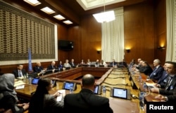 An overview of the room where Staffan de Mistura, the U.N. mediator for Syria, and the Syrian delegation, led by Syrian Ambassador to the U.N. Bashar Jaafari, opened the Syrian peace talks at the U.N. European headquarters in Geneva, Switzerland, Jan. 29,