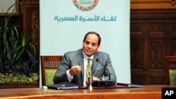 FILE - Egyptian President Abdel-Fattah el-Sissi, speaks during a live broadcast, in Cairo, Egypt. Under Sissi, The military has taken the lead in carrying out a string of major projects, from building roads and overseeing housing construction to providing cheap food to the public.