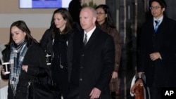 Deputy U.S. trade representative Jeffrey D. Gerrish, center, and members of his delegation leave the Westin hotel in Beijing, China, Jan. 7, 2019, for talks with their Chinese counterparts.