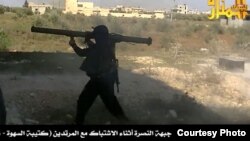 Syria's al-Nusra rebels post a photo of its fighters using an M-79 anti-tank weapon.