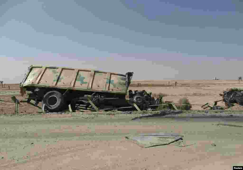 A destroyed military vehicle belonging to the Iraqi security forces is seen on the outskirts of Haditha, northwest of Baghdad, Aug. 26, 2014.&nbsp;