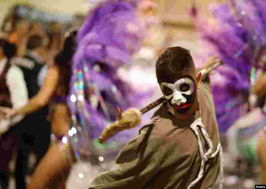 Members of a comparsa, an Uruguayan carnival group, participate in the Llamadas parade, a street fiesta with a traditional Afro-Uruguayan roots, in Montevideo, Uruguay, Feb. 7, 2019.