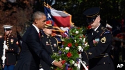 FILE - President Barack Obama lays a wreath at the Tomb of the Unknown Soldier.