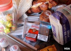 The Tobacco Control Bill would impose strict limits on marketing tobacco, and bans displaying it in shops, July 4, 2014. (H. Heuler/VOA News)