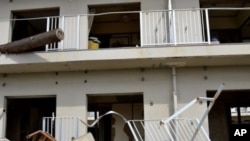 A tsunami devastated apartment building in Ishinomaki, March 9, 2012.