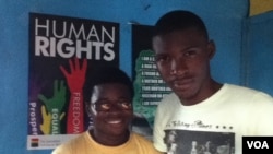 George Freeman (glasses) and co-worker Bernard Wilson at their Freetown office. (VOA - N. deVries)