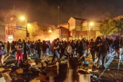 Protesters gather in front of the Third Police Precinct on May 28, 2020 in Minneapolis, Minnesota, during a demonstration over the death of George Floyd, an unarmed black man, who died after a police officer kneeled on his neck for several minutes