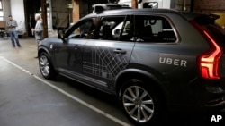 FILE - An Uber driverless car is displayed in a garage in San Francisco, Dec. 13, 2016. Uber announced Dec. 22, 2016, it is moving its self-driving cars to Arizona.