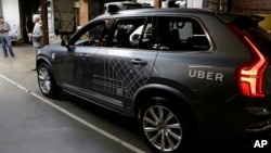 FILE - An Uber driverless car is displayed in a garage in San Francisco, Dec. 13, 2016. Uber announced Dec. 22, 2016, it is moving its self-driving cars to Arizona.