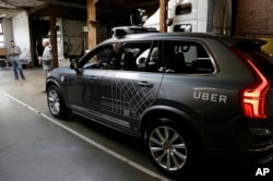 FILE - An Uber driverless car is displayed in a garage in San Francisco, Dec. 13, 2016.