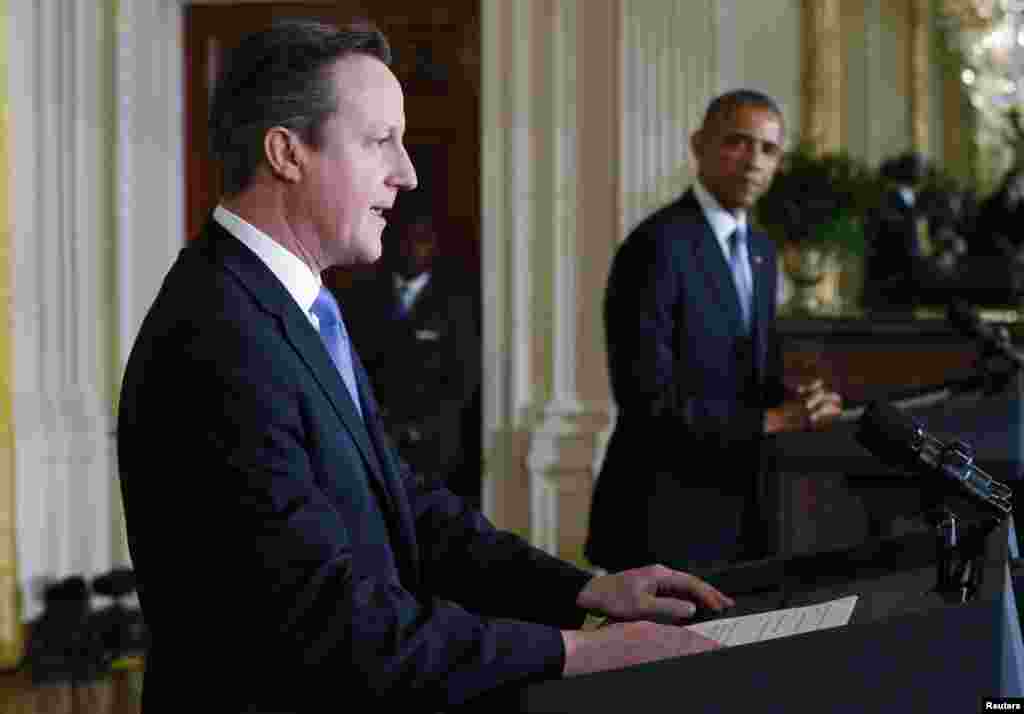 U.S. President Barack Obama and British Prime Minister David Cameron appear at their joint press conference following their meeting at the White House in Washington, Jan. 16, 2015.