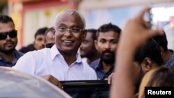 Maldivian opposition presidential candidate Ibrahim Mohamed Solih arrives at an event with supporters in Male, Maldives, Sept. 24, 2018. The country's election commission Saturday declared him the winner in last week's poll.
