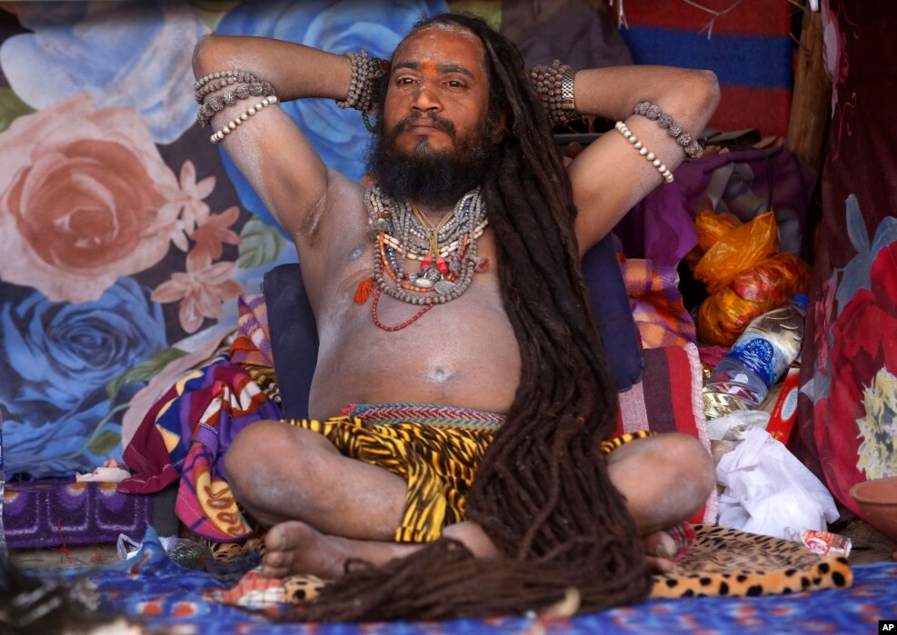 A Naga sadhu, or naked Hindu holy man, rests inside his tent during the month long Kumbh festival at Ujjain in the central Indian state of Madhya Pradesh.