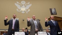 Witnesses, from left, Paul Combetta and Bill Thornton, both of Platte River Networks, and Justin Cooper are sworn in on Capitol Hill in Washington, Sept. 13, 2016, prior to a congressional panel hearing on Hillary Clinton's use of a private email server.
