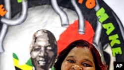 Nelson Mandela's personal cook Xoliswa Ndoyiya poses in Johannesburg after the release of her cookbook entitled "Ukutya Kwasekhaya: Tastes from Nelson Mandela's Kitchen" featuring the former South African President's favourite food, (File December 14, 201