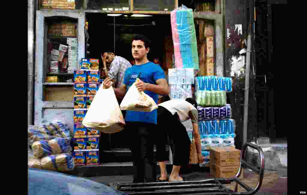 As fighting continues in and around the city, shops remain open and life appears surprisingly normal. (J. Weeks/VOA)