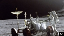 In 1971, Falcon Lunar module pilot James Irwin walks on the moon, working with the Lunar Roving Vehicle.