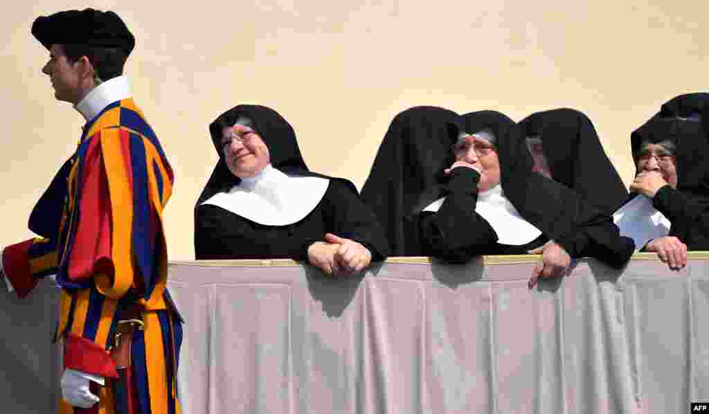 Nuns stand at St. Peter&#39;s Square at the Vatican at the end of the Pope&#39;s weekly general audience.