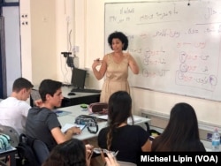 Iranian-born Israeli teacher Hanna Jahanforooz teaches Farsi to 17-year-old Israelis at the Ben Gurion High School in Petah Tikva, Israel on October 8, 2018.