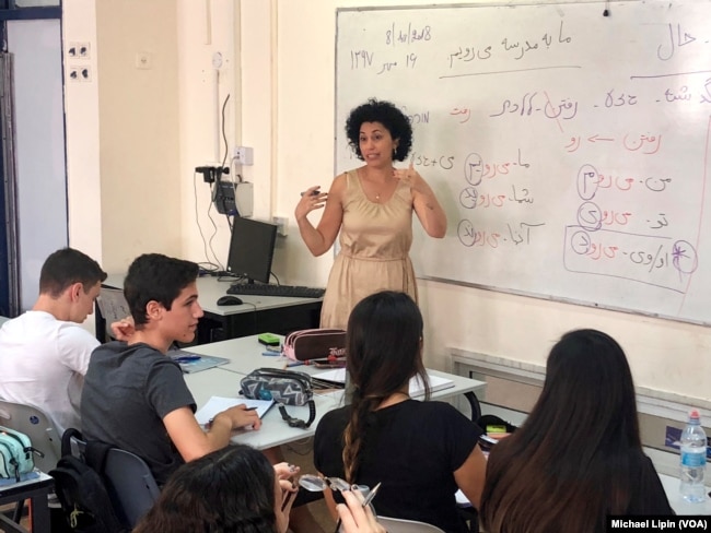 Iranian-born Israeli teacher Hanna Jahanforooz teaches Farsi to 17-year-old Israelis at the Ben Gurion High School in Petah Tikva, Israel on October 8, 2018.