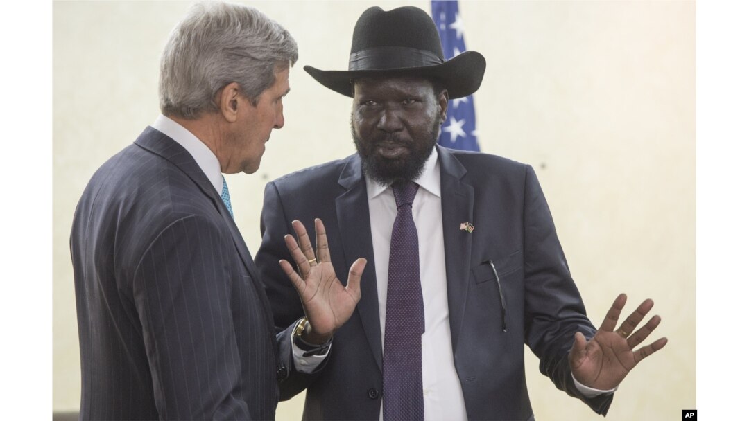 South Sudan's President Salva Kiir, right, chats with John Kerry as he greets him at the President's Office in Juba, S. Sudan, May 2, 2014.
