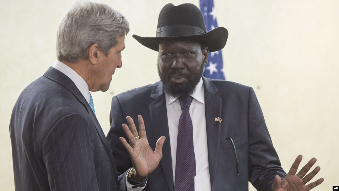 South Sudan's President Salva Kiir, right, chats with U.S. Secretary of State John Kerry during a visit to Juba on Friday, May 2, 2014.