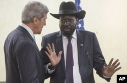 South Sudan's President Salva Kiir, right, chats with John Kerry as he greets him at the President's Office in Juba, S. Sudan, May 2, 2014.