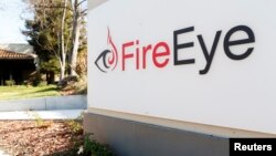 Security firm FireEye's logo is seen outside the company's offices in Milpitas, California.