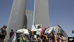Israeli demonstrators block a main junction with tents as they protest against rising housing prices and social inequalities, Tel Aviv, Israel, July 25, 2011