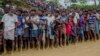 FILE - Rohingya Muslim men, who crossed over from Myanmar into Bangladesh, wait for their turn to collect food items distributed by aid agencies in Balukhali refugee camp, Bangladesh, Sept. 19, 2017. 