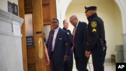 FILE - Bill Cosby, second from right, arrives at the Montgomery County Courthouse for his sexual assault trial, June 7, 2017.