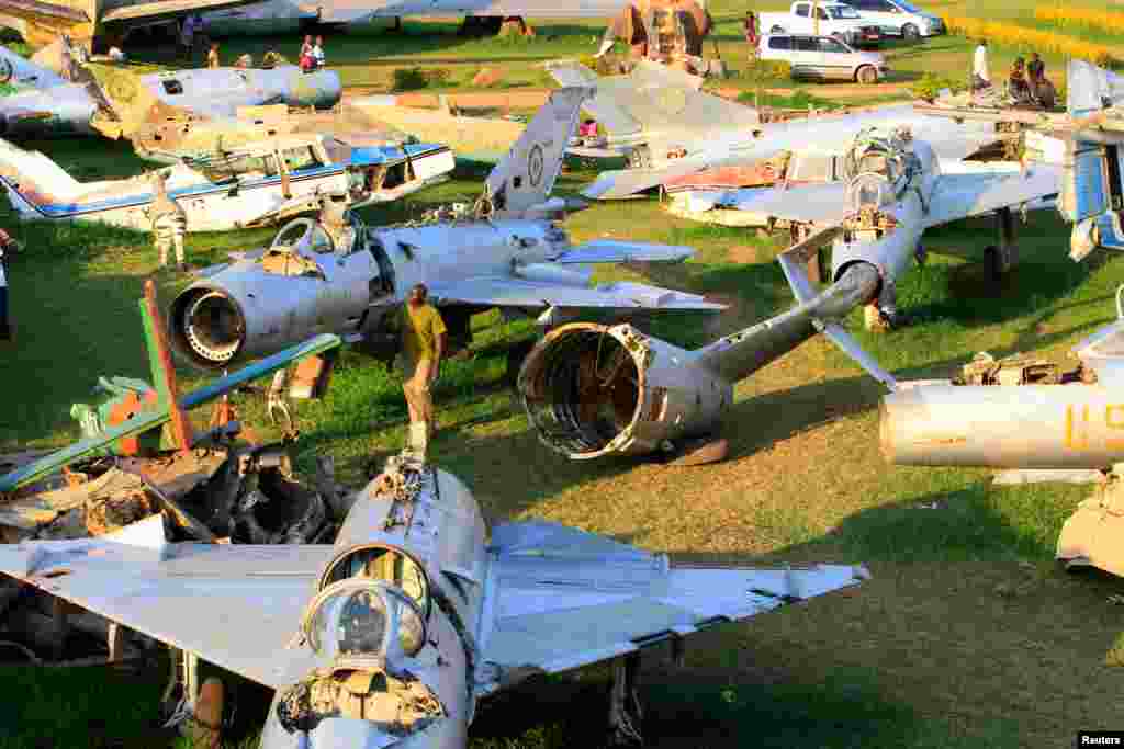 Jaffa Amin, the son of Uganda's late president Idi Amin Dada, views the wreckage of war planes destroyed during an Israeli operation on the Entebbe international airport in 1976 to rescue hostages, at Aero beach, south of Uganda's capital Kampala, July 3, 2016.