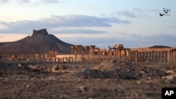 FILE - This image posted Sunday, Dec. 11, 2016, by the Aamaq News Agency, a media arm of the Islamic State group, purports to show a general view of the ancient ruins of the city of Palmyra.