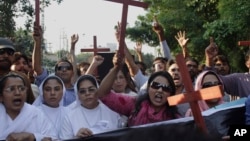 Pakistani Christians chant slogans to condemn the killing of a Christian couple during a demonstration in Lahore, Pakistan, Nov. 5, 2014. 