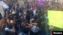 Marchers protest against police shootings of two black men in Louisiana and Minnesota during a demonstration in Dallas, Texas, U.S. July 7, 2016. 