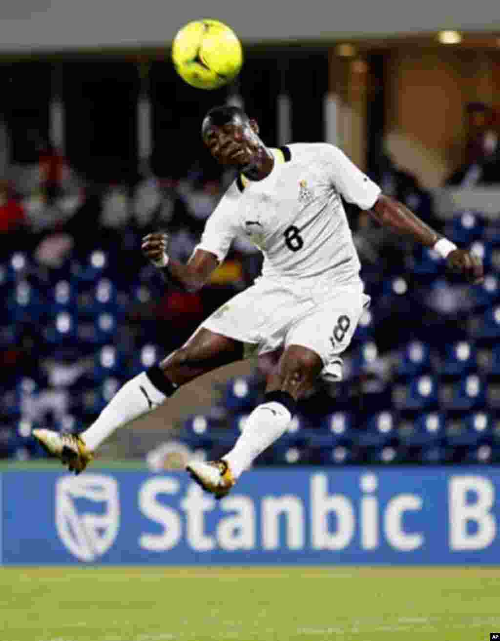 Ghana's Emmaneul Badu Agyemang jumps for the ball during their African Nations Cup quarter-final soccer match against Tunisia at Franceville stadium February 5, 2012.