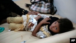 A girl is treated for suspected cholera infection at a hospital in Sanaa, Yemen, Saturday, Jul. 1, 2017.