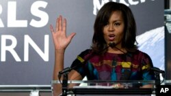 FILE - First lady Michelle Obama speaks at an event promoting the Let Girls Learn initiative in Washington, March 8, 2016.