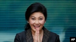 FILE - Thailand's former Prime Minister Yingluck Shinawatra arrives at the Supreme Court to make her final statements at her trial in Bangkok, Thailand, Aug. 1, 2017. She was convicted, sentenced in absentia, and is believed to be in Dubai.