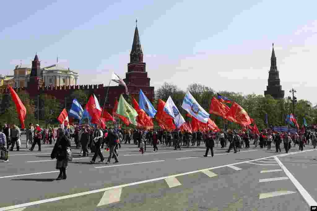 Thousands of Communists march along Kremlin Towers during May Day demonstration in downtown Moscow, May, 1, 2014.