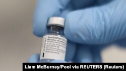 FILE PHOTO: A vial of the Pfizer/BioNTech COVID-19 vaccine is seen ahead of being administered at the Royal Victoria Hospital in Belfast