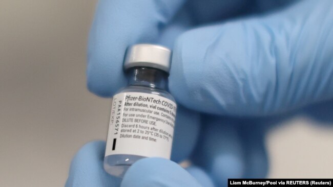 FILE PHOTO: A vial of the Pfizer/BioNTech COVID-19 vaccine is seen ahead of being administered at the Royal Victoria Hospital in Belfast