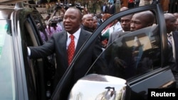 Kenya's Deputy Prime Minister Uhuru Kenyatta leaves after he was cleared by the Independent Electoral and Boundaries Commission to run for presidency in the March 4 presidential elections, in capital Nairobi, Kenya, Jan. 30, 2013.