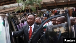 Kenya's Deputy Prime Minister Uhuru Kenyatta leaves after he was cleared by the Independent Electoral and Boundaries Commission to run for presidency in the March 4 presidential elections, in capital Nairobi, Kenya, Jan. 30, 2013.