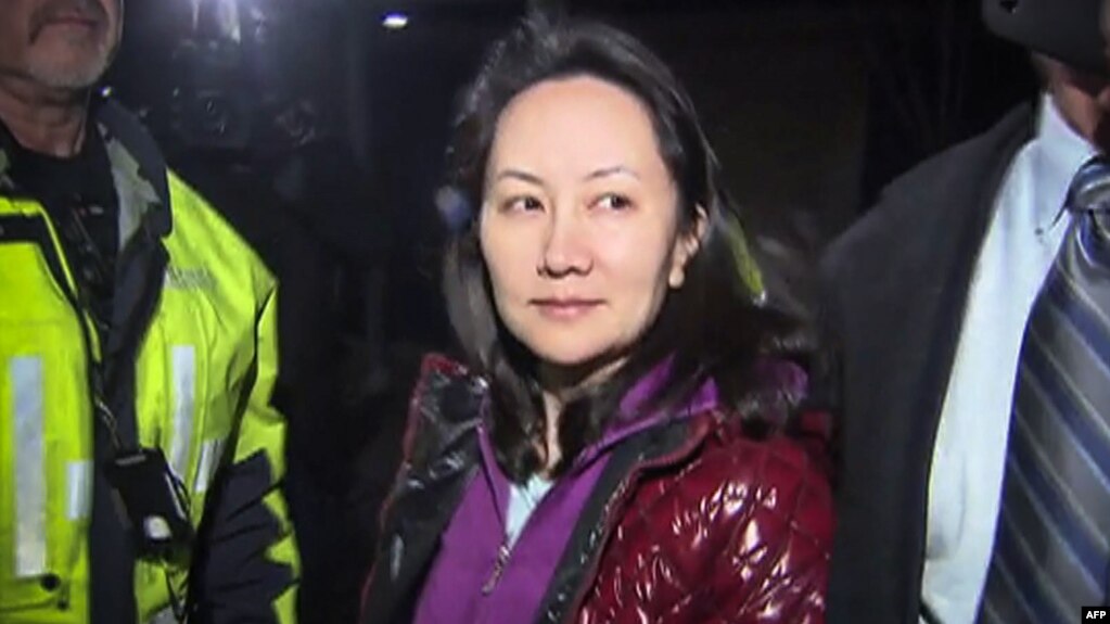 FILE - Huawei Technologies Chief Financial Officer Meng Wanzhou as she exits the court registry following the bail hearing at British Columbia Superior Courts in Vancouver, British Columbia on Dec. 11, 2018.