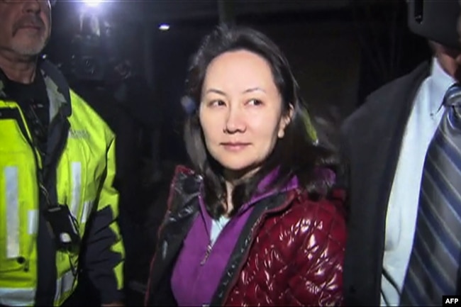 FILE - Huawei Technologies Chief Financial Officer Meng Wanzhou as she exits the court registry following the bail hearing at British Columbia Superior Courts in Vancouver, British Columbia on Dec. 11, 2018.