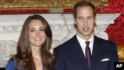 Britain's Prince William and his fiancee Kate Middleton pose for a photograph in St. James's Palace in central London, November 17, 2010